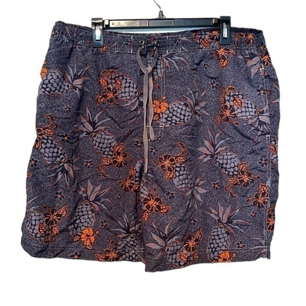 Men’s grayish blue swim trunks with pineapples and Hawaiian flowers, size XL
